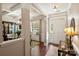 Welcoming foyer with decorative columns, hardwood floors, and view into dining room at 79115 Ridgehaven Rd, Lancaster, SC 29720