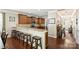 The kitchen has wooden cabinets, granite countertops, a tiled backsplash, stainless steel appliances, and a breakfast bar at 79115 Ridgehaven Rd, Lancaster, SC 29720