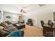 Cozy living room with plush sectional sofa, complemented by a ceiling fan and neutral decor at 79115 Ridgehaven Rd, Lancaster, SC 29720