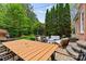 Beautiful backyard patio with dining and lounge areas, ideal for outdoor relaxation and entertaining at 8032 Turnberry Ln, Stanley, NC 28164