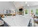 Kitchen with marble countertop island, open to the living room with a fireplace at 8032 Turnberry Ln, Stanley, NC 28164