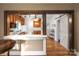 Kitchen view showcasing natural wood cabinets and a breakfast bar in an open-concept design at 872 Wellman St, Gastonia, NC 28054