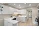 Clean kitchen with white cabinets, modern countertops, and tile flooring at 8326 Ramath Dr, Charlotte, NC 28211