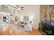 Bright living room with stone fireplace, neutral decor, and hardwood floors in modern home at 8326 Ramath Dr, Charlotte, NC 28211
