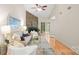Spacious living room with a stone fireplace, hardwood floors, and comfortable seating at 8326 Ramath Dr, Charlotte, NC 28211