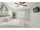 Main bedroom featuring a ceiling fan, a large window with shutters, and neutral walls at 8326 Ramath Dr, Charlotte, NC 28211