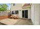 Charming patio area with a sliding door to the home and two wooden rocking chairs at 8326 Ramath Dr, Charlotte, NC 28211