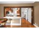 An inviting living room showcases hardwood floors and seamless transition to the kitchen with a breakfast bar at 872 Wellman St, Gastonia, NC 28054