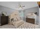 Cozy bedroom featuring unique bunk bed, ceiling fan, and neutral decor for a comfortable and stylish living space at 1102 Anniston Pl, Wesley Chapel, NC 28079