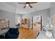 Versatile bonus room with hardwood floors, a cozy seating area, and natural light for flexible living at 1102 Anniston Pl, Wesley Chapel, NC 28079