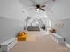 Spacious bonus room with neutral carpet, ample play space, and a ceiling fan for a comfortable atmosphere at 1102 Anniston Pl, Wesley Chapel, NC 28079