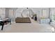 Bright bonus room with vaulted ceiling, comfortable seating, and a game area perfect for entertaining and relaxation at 1102 Anniston Pl, Wesley Chapel, NC 28079