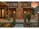 This is a beautiful property featuring brick exterior and an outdoor living area at 1102 Anniston Pl, Wesley Chapel, NC 28079