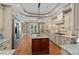 Gourmet kitchen with a center island, granite countertops, and stainless steel appliances at 1102 Anniston Pl, Wesley Chapel, NC 28079