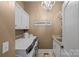 The laundry room features modern appliances and ample cabinet space, adding convenience at 1102 Anniston Pl, Wesley Chapel, NC 28079
