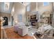 Spacious living room featuring a stone fireplace, built-in shelves, and hardwood floors at 1102 Anniston Pl, Wesley Chapel, NC 28079
