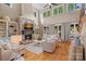 Spacious living room featuring a stone fireplace, built-in shelves, and hardwood floors at 1102 Anniston Pl, Wesley Chapel, NC 28079