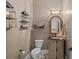The charming powder room boasts stylish fixtures and decor, making it a delightful space at 1102 Anniston Pl, Wesley Chapel, NC 28079