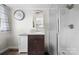 Clean and functional bathroom featuring a standing shower, sink, and mirrored cabinet at 127 Bristol Rd, Statesville, NC 28677