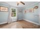 Bright bedroom featuring wood floors, soothing color palette, and natural light at 127 Bristol Rd, Statesville, NC 28677