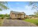 Charming single-Gathering home featuring a cozy front porch and gravel driveway at 127 Bristol Rd, Statesville, NC 28677