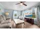 Cozy living room with ample natural light, hardwood floors, and comfortable seating at 127 Bristol Rd, Statesville, NC 28677