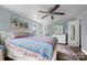 Bright main bedroom featuring wood flooring, ceiling fan, and a serene atmosphere at 127 Bristol Rd, Statesville, NC 28677
