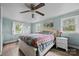 Comfortable main bedroom offering natural light, wood flooring, and ceiling fan at 127 Bristol Rd, Statesville, NC 28677