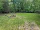 Large, lush backyard perfect for outdoor activities and relaxation at 127 Hummingbird Cir, New London, NC 28127