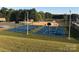 Community park featuring two full-sized basketball courts, picnic tables, and playground at 127 Hummingbird Cir, New London, NC 28127