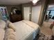 Comfortable bedroom with cozy rug, dresser, ample closet space and a large window with natural light at 127 Hummingbird Cir, New London, NC 28127