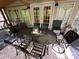 Charming outdoor dining space on the covered deck, perfect for entertaining guests at 127 Hummingbird Cir, New London, NC 28127