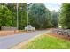 Inviting community entrance with stone signage and well-maintained landscaping at 127 Hummingbird Cir, New London, NC 28127