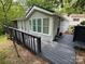 Charming home exterior with well-maintained siding and a lovely deck at 127 Hummingbird Cir, New London, NC 28127