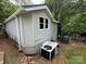 Exterior of the home with light siding, showing the AC unit and back entrance at 127 Hummingbird Cir, New London, NC 28127