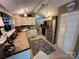 Spacious kitchen featuring ample counter space, stainless steel appliances, and custom cabinets at 127 Hummingbird Cir, New London, NC 28127