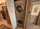 Convenient laundry area featuring a modern, stackable washer and dryer unit at 127 Hummingbird Cir, New London, NC 28127