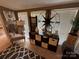 Bright living area with decorative accents, a cozy armchair and large windows at 127 Hummingbird Cir, New London, NC 28127