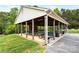 Outdoor pavilion with picnic tables and a brick fireplace, perfect for gatherings and community events at 127 Hummingbird Cir, New London, NC 28127