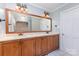 Bathroom with double sinks and a large mirror at 1468 Woodhurst Dr, Rock Hill, SC 29732