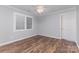 Neutral bedroom featuring a ceiling fan, and wood flooring, illuminated by natural light at 1468 Woodhurst Dr, Rock Hill, SC 29732