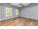 Bedroom with hardwood floors, two windows and a ceiling fan at 1468 Woodhurst Dr, Rock Hill, SC 29732