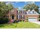 Charming brick two-story home with manicured lawn and attached two car garage in desirable neighborhood at 1468 Woodhurst Dr, Rock Hill, SC 29732