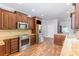 Well-equipped kitchen featuring granite countertops, stainless steel appliances, and wood flooring at 1468 Woodhurst Dr, Rock Hill, SC 29732