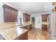 Charming kitchen featuring granite countertops, stainless steel appliances, and wood flooring at 1468 Woodhurst Dr, Rock Hill, SC 29732