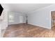 Bright living room with hardwood floors, white trim, and a door leading to the backyard at 1468 Woodhurst Dr, Rock Hill, SC 29732