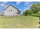 Spacious backyard featuring lush grass, a fence line, and mature trees for added privacy at 1552 Trentwood Dr, Fort Mill, SC 29715