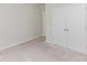 Neutral bedroom features carpet and a double door closet for ample storage at 1552 Trentwood Dr, Fort Mill, SC 29715