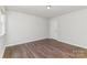 This light and airy bedroom features laminate flooring, offering a modern and easy-to-maintain space at 1552 Trentwood Dr, Fort Mill, SC 29715