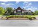 Beautiful clubhouse exterior surrounded by lush landscaping and a well-maintained entrance at 1552 Trentwood Dr, Fort Mill, SC 29715